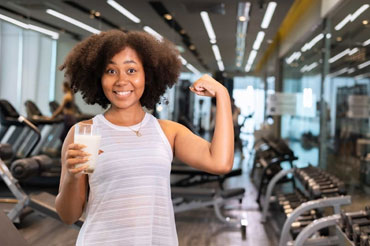Female training with glass of milk
