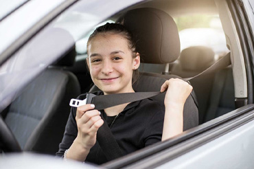 Young driver using seatbelt