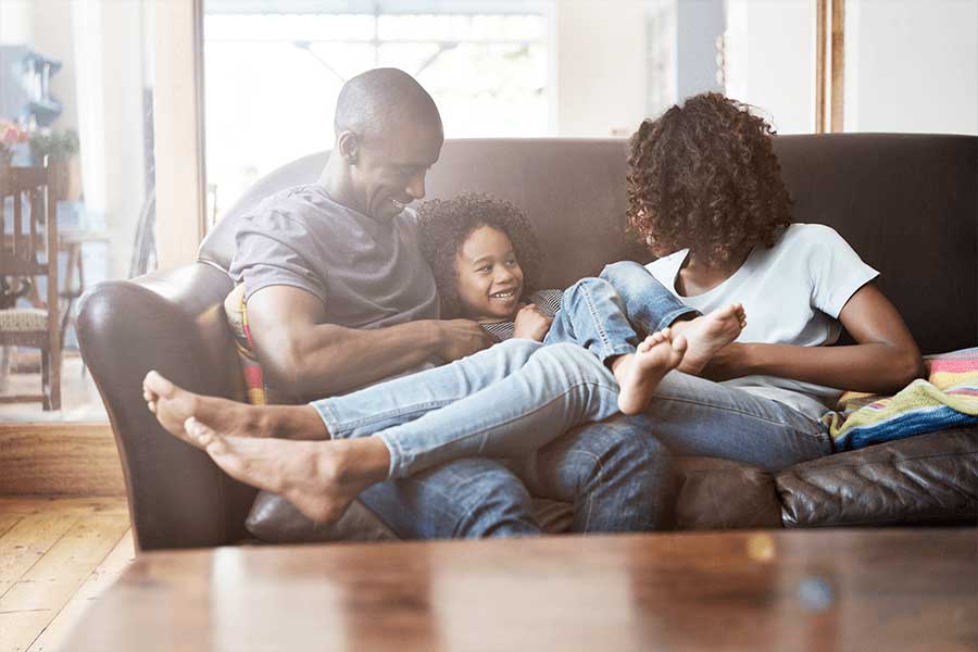 Family on Couch in their condo